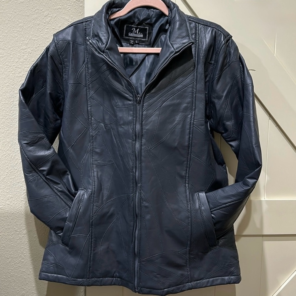Genuine leather grey coat with pockets.